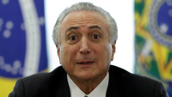 Brazil's interim President Michel Temer reacts during a meeting with leaders of the Allied Base of parties in the Chamber of Deputies, at the Planalto Palace in Brasilia, Brazil, May 17, 2016. 