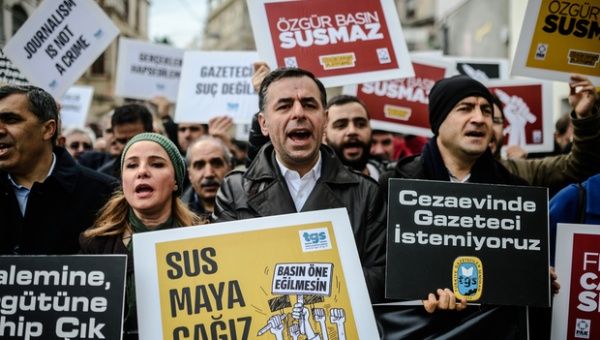 Turkish journalists hold placards reading 