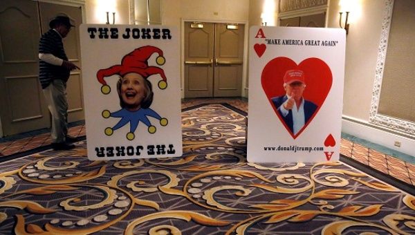 Posters of U.S. Republican presidential candidate Donald Trump and Democratic presidential candidate Hillary Clinton are seen outside Trump's Nevada caucus night rally in Las Vegas, Nevada.