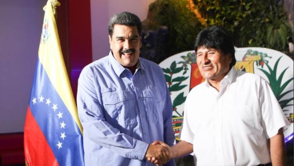 Bolivian President Evo Morales is welcomed by his Venezuelan counterpart Nicolas Maduro at the Maiquetia International Airport of Caracas, Venezuela, May 21, 2016.