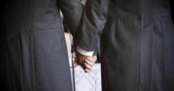 Australian MP Ian Hunter (L) holds hands with his partner Leith Semmens during their wedding in the town of Jun, southern Spain, in this file photo dated Dec. 19, 2012.