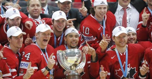 Players of Canada pose with their gold medals and the trophy during the victory ceremony after the final game.