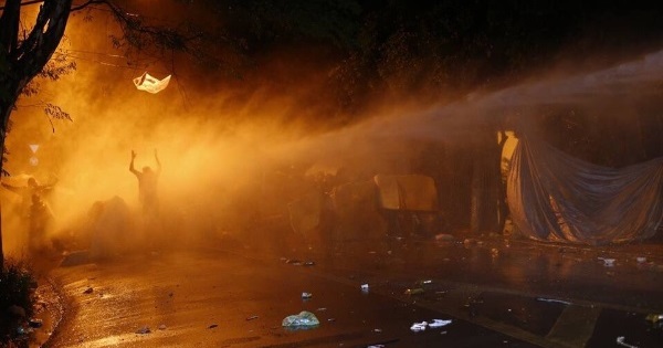 Water and teargas being used by police against protesters who reject the coup-imposed government in Brazil.