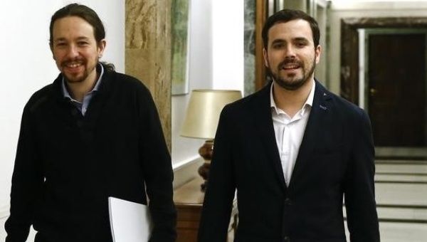 In an archive image, the leaders of Podemos, Pablo Iglesias (L), and United Left, Alberto Garzón, arrive for a press conference in Madrid, Feb. 18, 2016.
