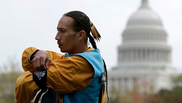 A Navajo man stands outside the U.S. Capitol in Washington, DC