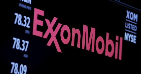 The logo of Exxon Mobil Corporation is shown on a monitor above the floor of the New York Stock Exchange in New York.