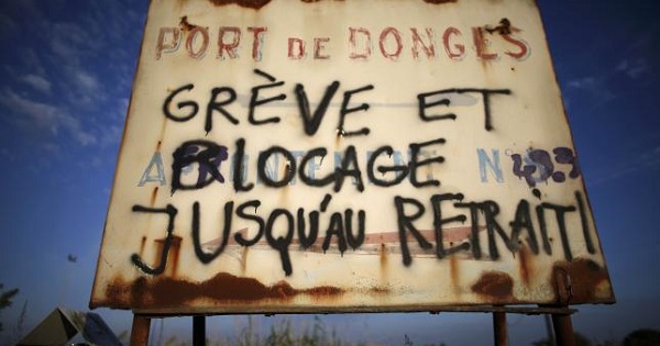 A message reads ''Strike and blockade until withdrawal'' near a blockade at the depot of the SFDM company near the oil refinery to protest the labor reforms in Donges, France, May 26, 2016.
