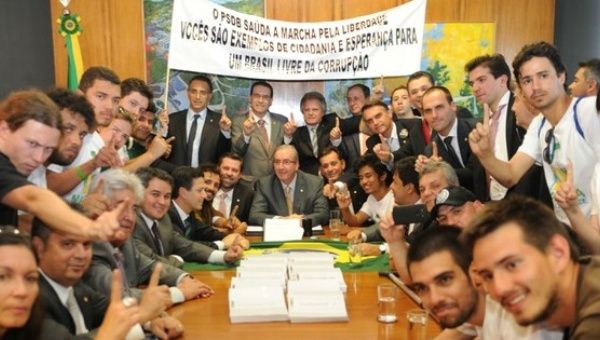 Members of the Free Brazil Movement pose for a photo after meeting with the former head of the lower chamber of Congress, Eduardo Cunha.