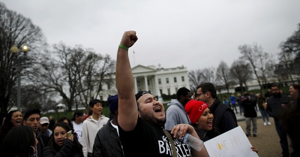 Anti-deportation demonstrators protest outside of the White House in Washington.