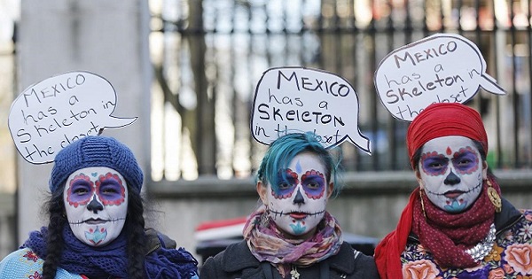 Protesters demonstrate against alleged human rights abuses in Mexico, near Downing Street in London, March 3, 2015.