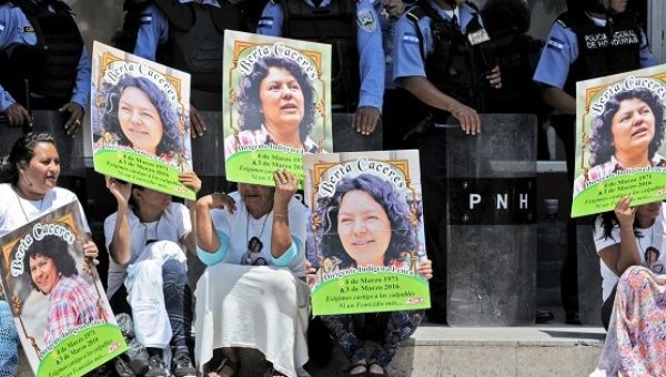 Activists demand justice for Berta Caceres in front of a police line in Tegucigalpa, Honduras, March 17, 2016.