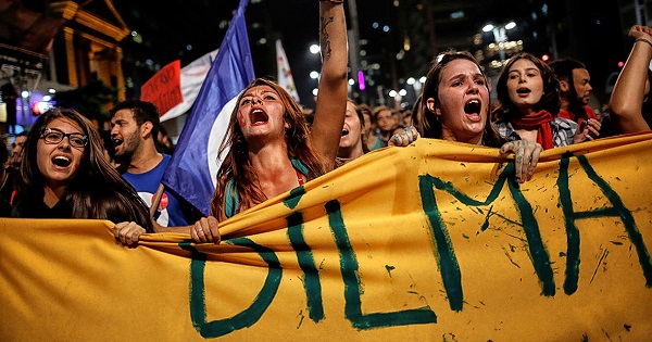 Women shout at a protest against Brazil's interim President Michel Temer and in support of suspended President Dilma Rousseff at Paulista Avenue in Sao Paulo.