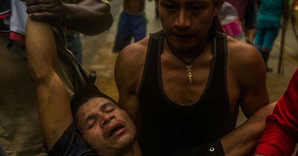 Participants of the agrarian strike carry a demonstrator allegedly wounded by police, in the Department of Choco, Colombia, June 1, 2016.