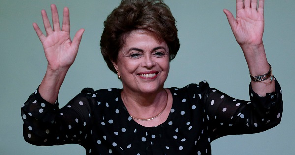 Suspended President Dilma Rousseff waves during the launch ceremony of the book 