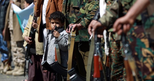 Yemeni children hold automatic rifles as they join grown up relatives in a tribal gathering.