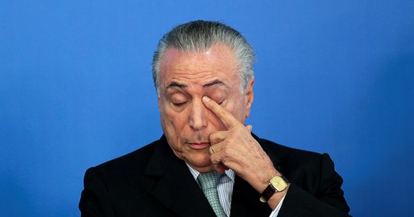 Brazil's interim President Michel Temer gestures during a inauguration ceremony of the new Minister of Transparency, Torquato Jardimin in Brasilia, Brazil.