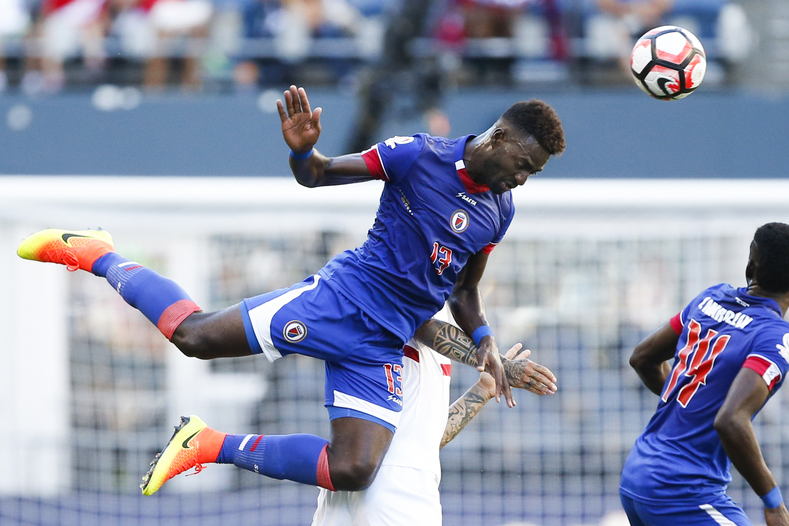Haiti midfielder Kevin Lafrance (13) goes airborne for a header against Peru during the first half of the group play stage of the 2016 Copa America Centenario at Century Link Field. 