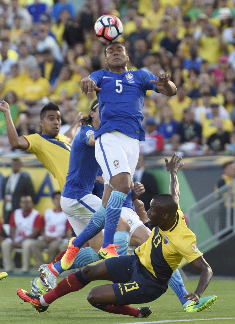 Ecuador forward Enner Valencia (13) falls off a free kick as Brazil midfielder Casemiro (5) heads the ball away during the first half during the group play stage of the 2016 Copa America Centenario at Rose Bowl Stadium. 