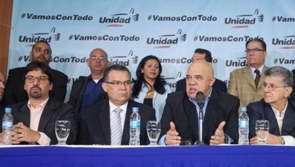 MUD Secretary-General Jesus Torrealba (2ndR) speaks during a press conference in Caracas, Venezuela, flanked by senior MUD figures. 