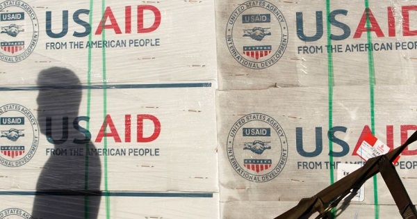 A shadow is cast on boxes of relief items from U.S. Agency for International Development.