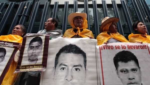 Families of the 43 forcibly disappeared Ayotzinapa students protest outside the Attorney General's office in Mexico City, May 26, 2016.
