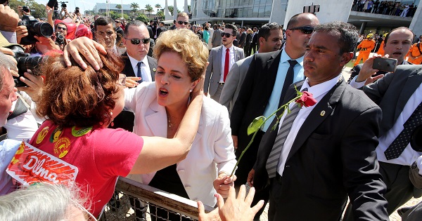 Suspended Brazilian President Dilma Rousseff greets a supporter after the Brazilian Senate voted to suspend her, at Planalto Palace in Brasilia, May 12, 2016.