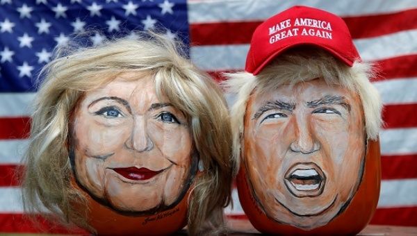 The images of U.S. Democratic presidential candidate Hillary Clinton and Republican Donald Trump are seen painted on pumpkins by artist John Kettman. 