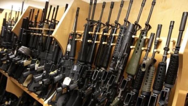 AR-15 rifles line a shelf in the gun library at the U.S. Bureau of Alcohol, Tobacco and Firearms National Tracing Center in Martinsburg, West Virginia. 