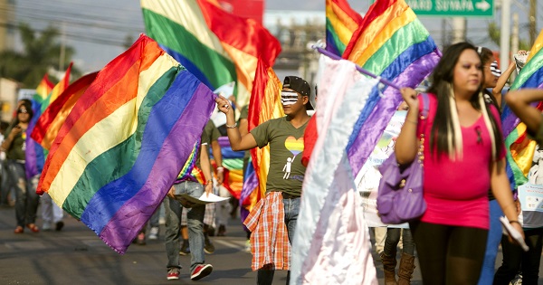 Members of Honduran LGBTQ organizations march in the capital city Tegucigalpa to demands justice for murdered community leaders, May 17, 2013.