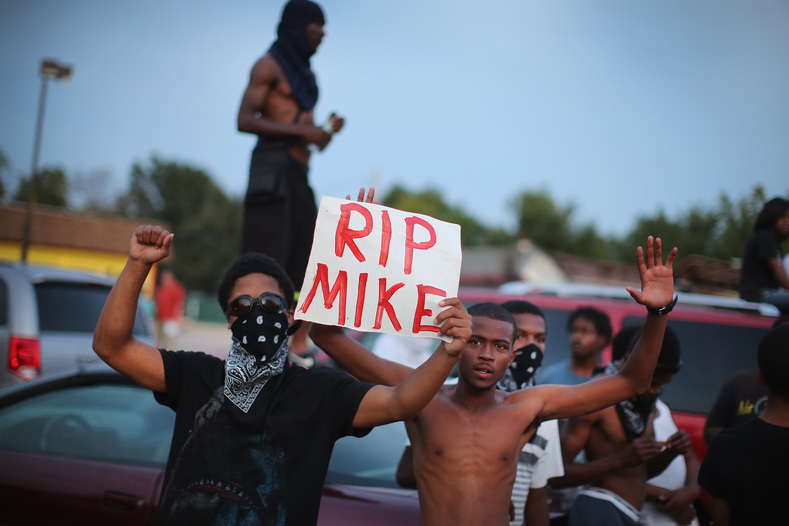 Demonstrators gather along West Florissant Avenue to protest the shooting death of Michael Brown on August 14, 2014 in Ferguson, Missouri. Violent protests have erupted along West Florissant in Ferguson each of the last four nights as demonstrators express outrage over the shooting death of Michael Brown by a Ferguson police officer on August 9. 