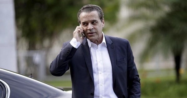 Henrique Eduardo Alves, former tourism minister in the Brazilian coup government, talks on his mobile phone in Brasilia, Brazil, December 14, 2015.