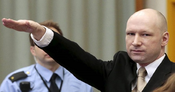Terrorist Anders Behring Breivik raises his arm in a Nazi salute as he enters the court room in Norway's Skien prison on Monday.