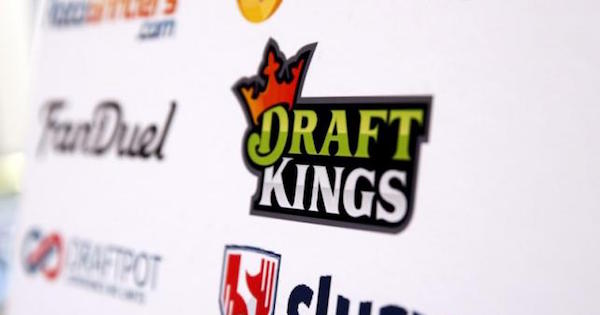 A DraftKings logo is displayed on a board inside of the DFS Players Conference in New York November 13, 2015.