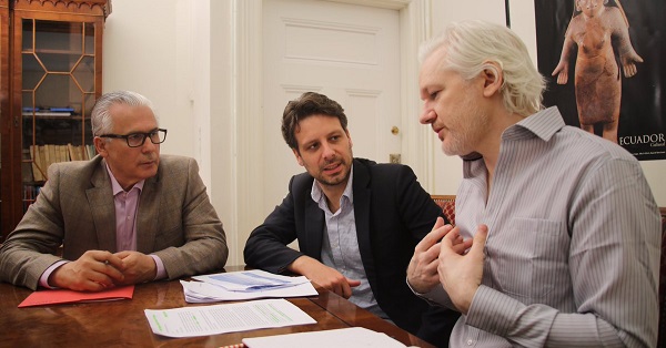 Lawyer Baltasar Garzon (L), Ecuadorean Foreign Minister Guillaume Long (C), and WikiLeaks founder Julian Assange talk inside the Ecuadorean Embassy in London, U.K., June 19, 2016.