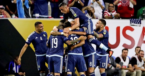 Argentina celebrates with teammates after a goal by Lionel Messi during the first half against the United States in the semifinals of the 2016 Copa America Centenario soccer tournament in Houston.