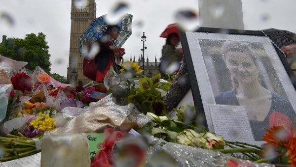 People view tributes in memory of murdered Labour Party MP Jo Cox at Parliament Square in London, June 20, 2016. 