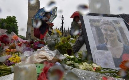 People view tributes in memory of murdered Labour Party MP Jo Cox at Parliament Square in London, June 20, 2016. 