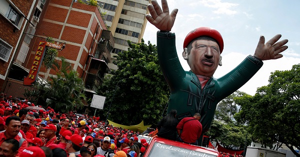 A giant inflatable doll of Venezuela's late President Hugo Chavez is seen during a pro-government rally in Caracas, Venezuela, June 22, 2016.