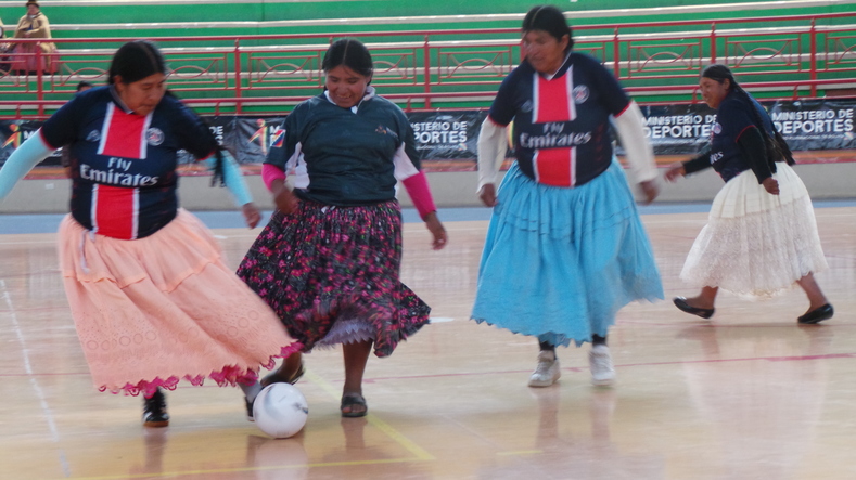 A group of cholitas mid-game as part of the all female competition.