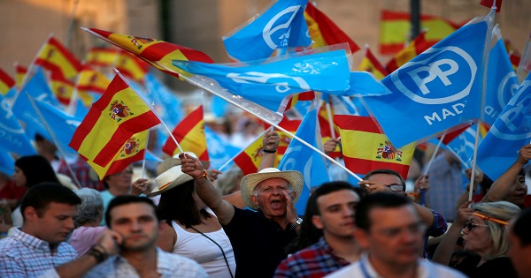 Popular Party supporters before the final campaign rally for Spain's general election in Madrid, Spain, June 24, 2016.