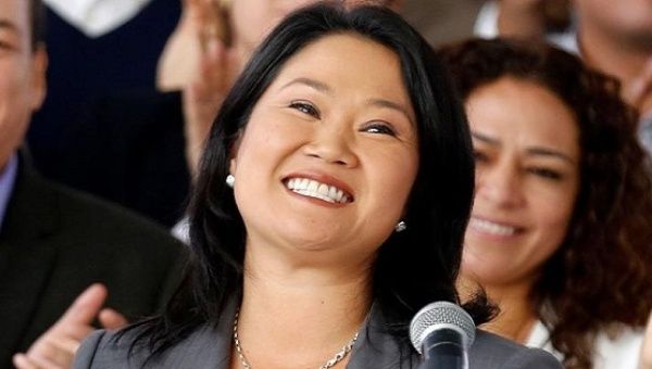 Keiko Fujimori, accompanied by elected congressmen, attends a news conference at her party's headquarters in Lima, Peru, June 10, 2016. 