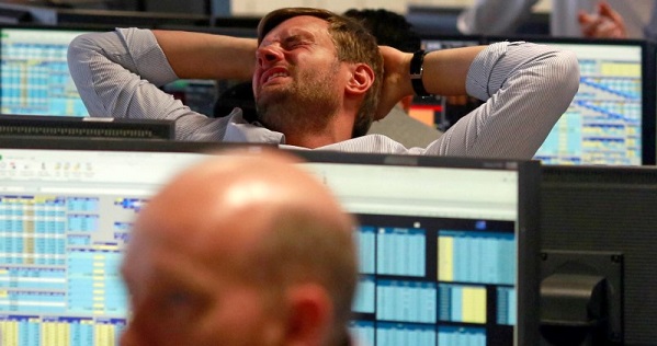 A trader from BGC, a global brokerage company in London's Canary Wharf financial center reacts during trading June 24, 2016.