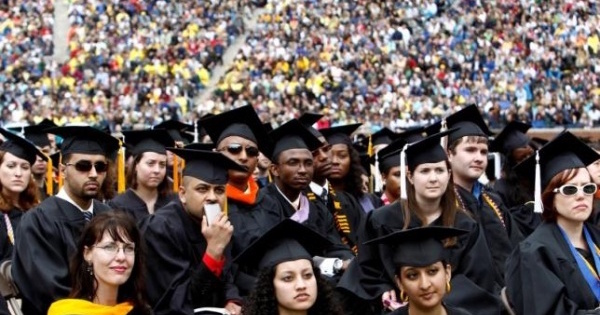 Graduating students listen to U.S. President Barack Obama speak at the University of Michigan commencement ceremony in Ann Arbor, Michigan May 1, 2010.