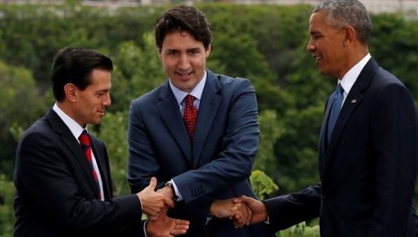 Mexico's President Enrique Pena Nieto, Canada's Prime Minister Justin Trudeau and U.S. President Barack Obama shake hands while posing for the family photo at the North American Leaders' Summit in Ottawa, Ontario, Canada, June 29, 2016.