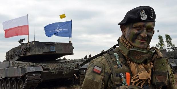 Polish tank comander smiles after a NATO Response Force (NRF) exercise in Zagan, southwest Poland on June 18, 2015.