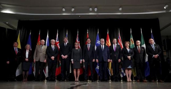 Canada's Prime Minister Justin Trudeau (6th R) poses with provincial and territorial premiers during the First Ministers' meeting in Ottawa, Canada, November 23, 2015.