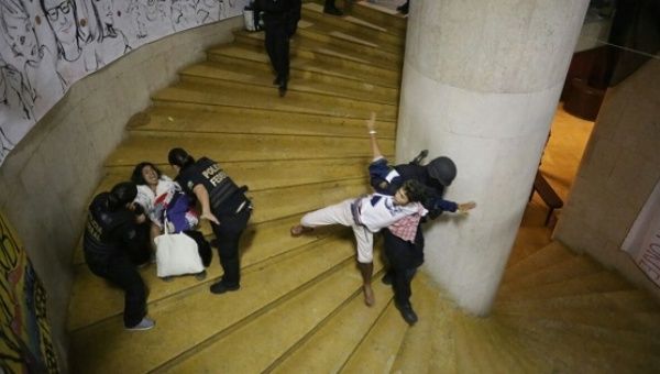 Brazilian Federal Police forcefully remove two demonstrators from the  Gustavo Capanema Palace in Rio de Janeiro, Brazil, July 25, 2016.
