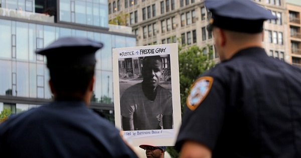 A man participates in a protest after Baltimore Police Officer Caesar Goodson Jr. was acquitted of all charges for his involvement in the death of Freddie Gray.