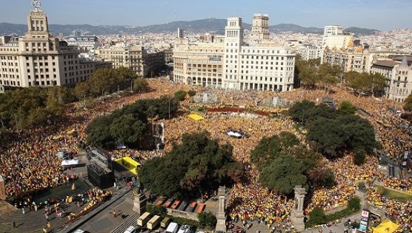 Thousands attend a gathering at the Catalonia Square in Barcelona, Spain, Oct. 19, 2014.