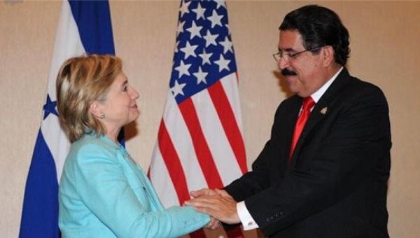 Honduras President Manuel Zelaya shakes hands with then US Secretary of State Hillary Clinton in 2006.